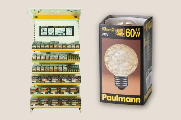 Shelf displaying various Paulmann LED bulbs with focus on 60W light bulb in brown packaging