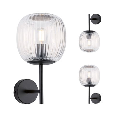 Wall lamp with ribbed clear glass and matte black metal, modern LED wall light fixture.