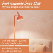 Orange Luna Style floor lamp with movable head for directed light in a modern living room setting