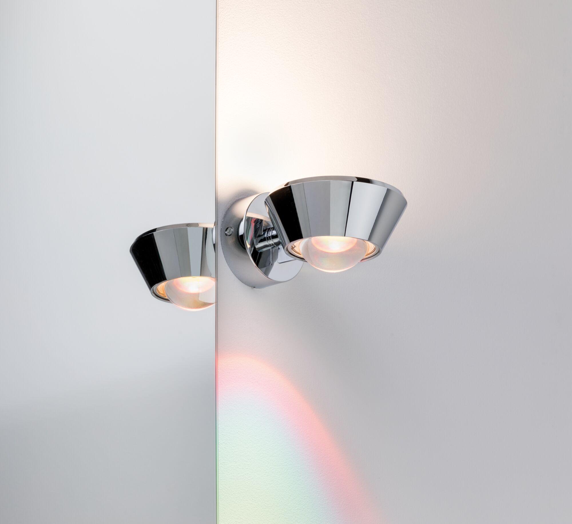 Chrome metal wall spotlight with conical shape and warm white light for modern interior lighting