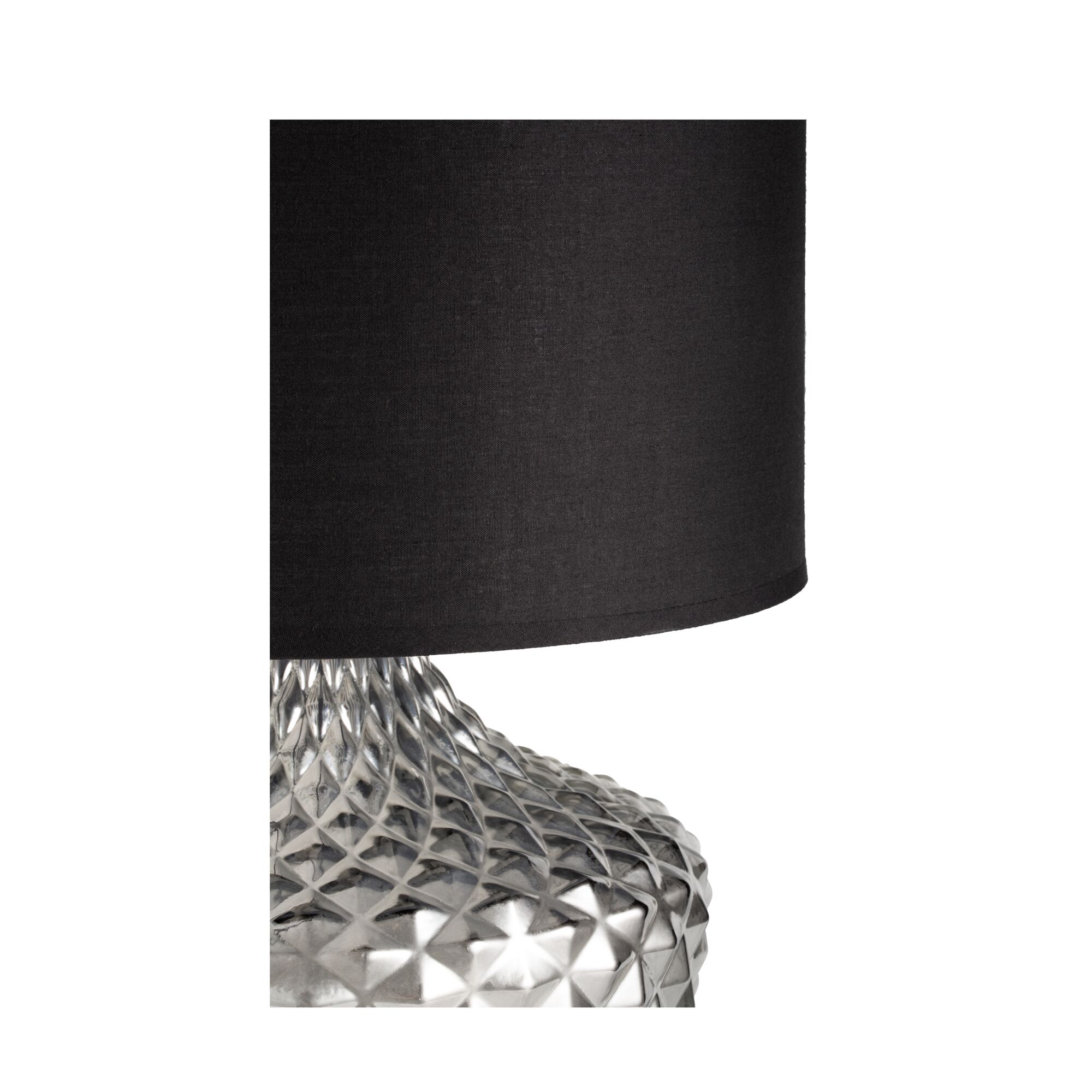 Table lamp with black fabric shade and silver textured metal base for modern interior lighting.