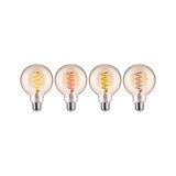 Vier decoratieve LED-lampen met gekleurde spiraalfilamenten in warm glas voor sfeerverlichting