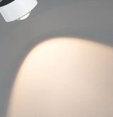 Modern white metal LED ceiling spotlight with warm white light for living spaces