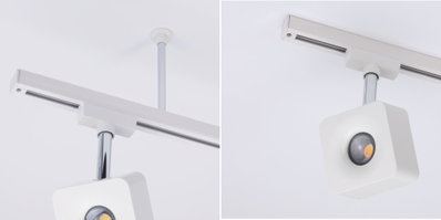 Modern white metal LED ceiling spotlight with square design and track system for accent lighting