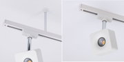 Modern white metal LED ceiling spotlight with square design and track system for accent lighting