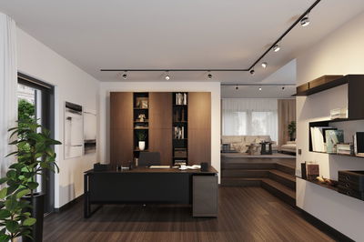 Modern office with black desk, wooden shelves and LED track lighting for workspace illumination