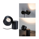 Black metal LED table and wall lamp with adjustable head for focused lighting in modern interiors