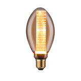 Glowing LED bulb with amber glass and decorative light rod for atmospheric lighting in interiors