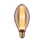Glowing LED bulb with amber glass and decorative light rod for atmospheric lighting in interiors
