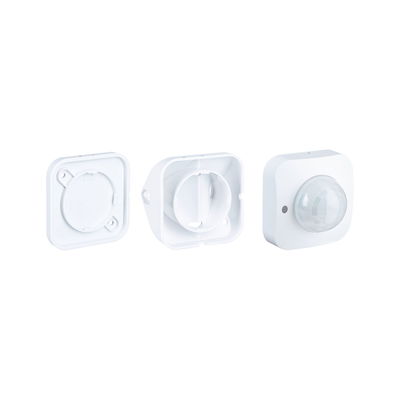 White plastic housing with motion sensor and two covers for light control