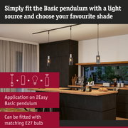 Modern Basic pendant light with black cable and glass shade in kitchen with wooden countertop