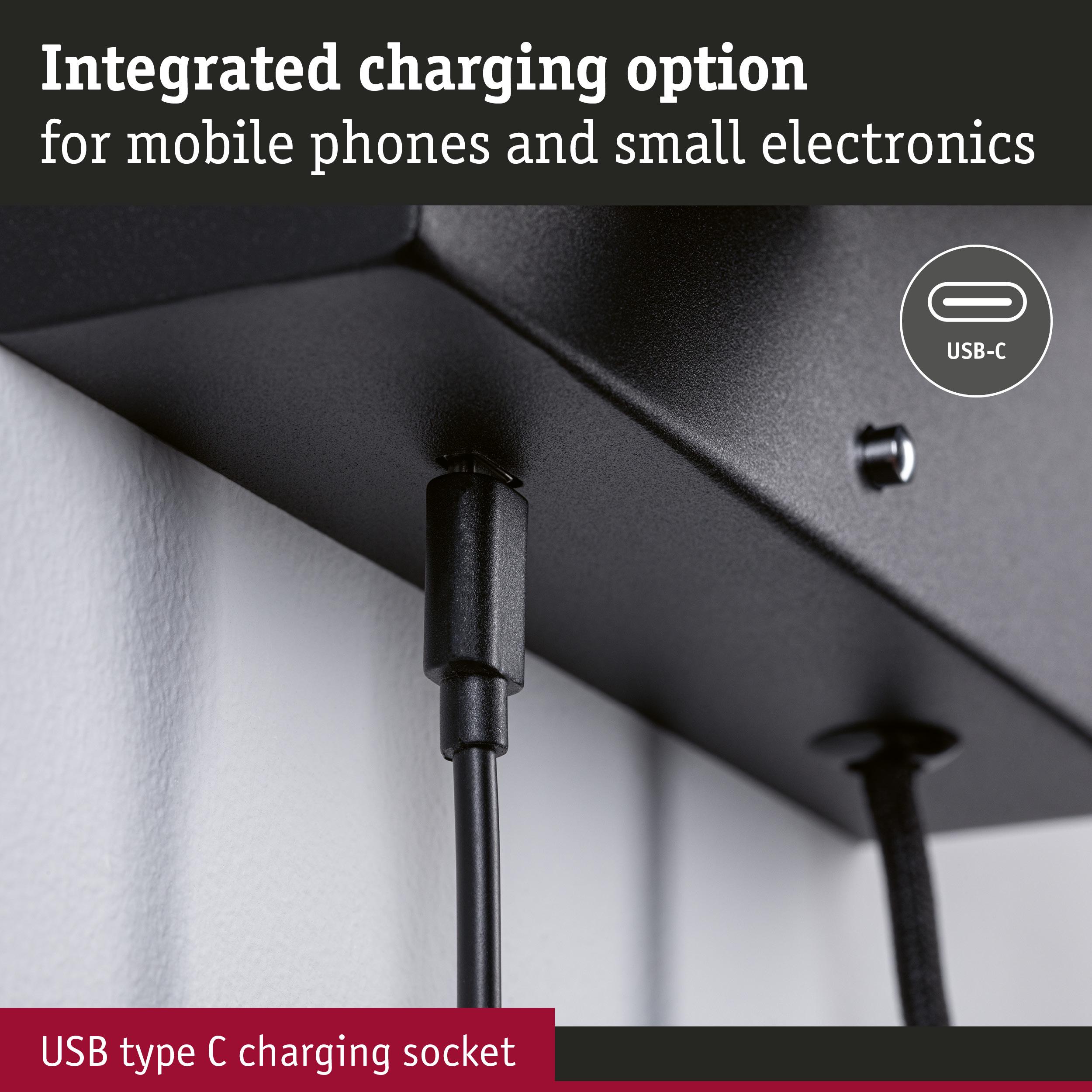 Black USB-C charging socket on black metal device for mobile phone and small electronics charging