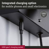 Black USB-C charging socket on black metal device for mobile phone and small electronics charging