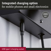 Black plastic USB-C charging socket with integrated charging port for mobile phones and electronics