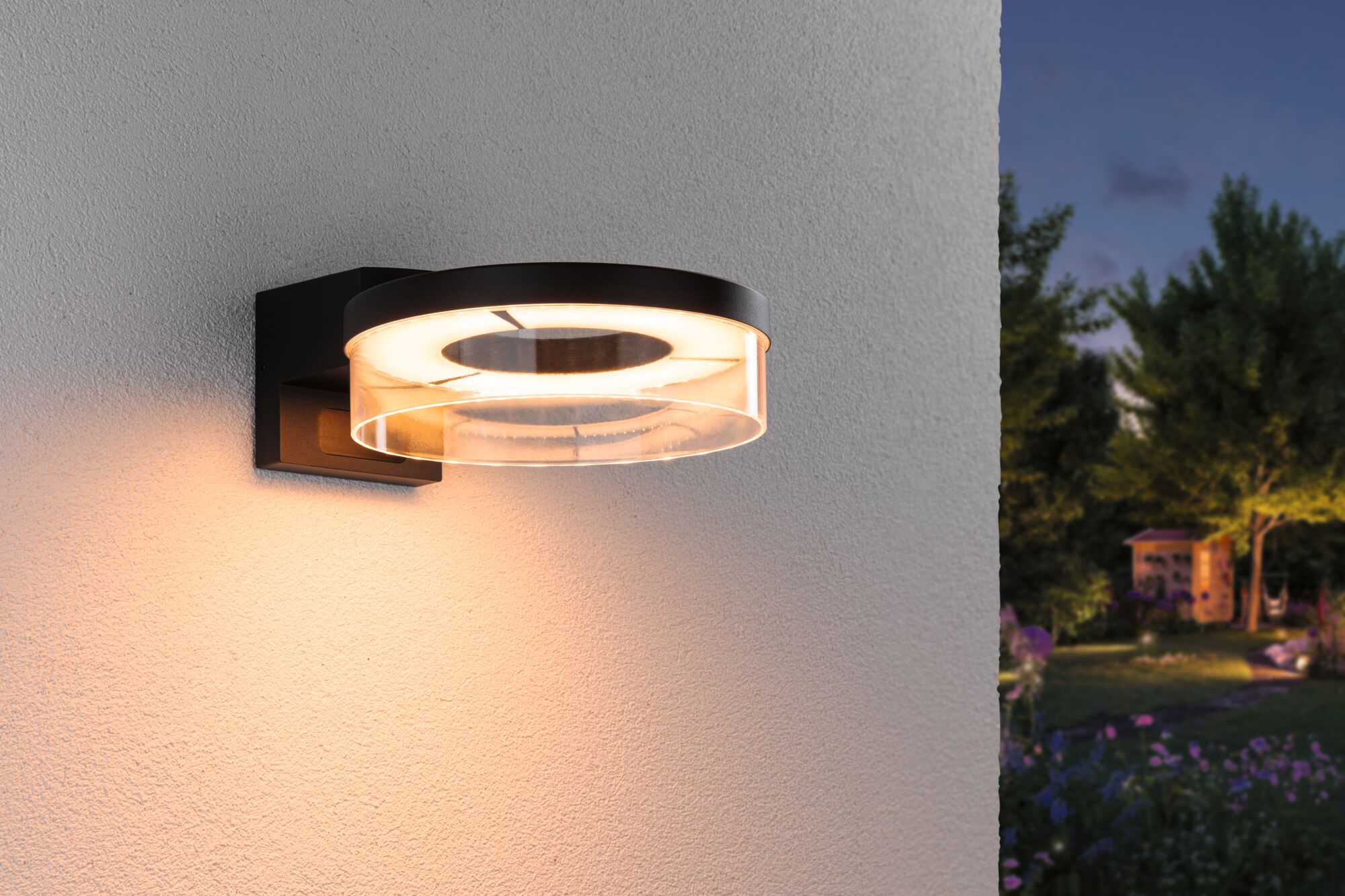 Modern black LED outdoor wall light with round acrylic glass and warm white light for garden lighting