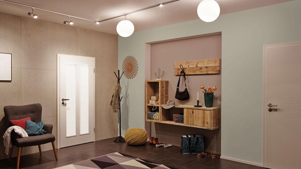 Modern hallway with colored walls, wooden shelf, and round ceiling lights for stylish room lighting