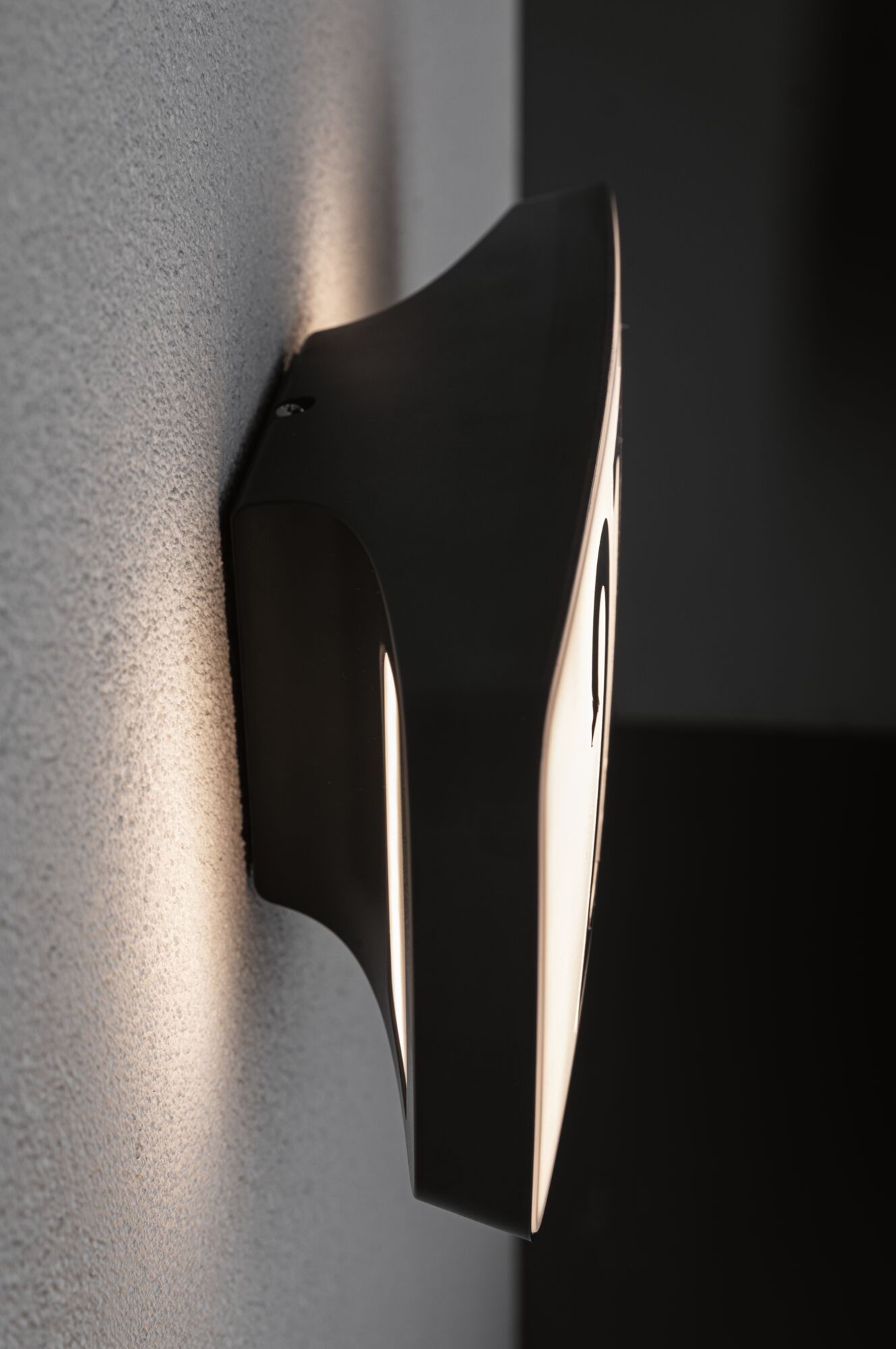 Black metal wall lamp with warm white light for modern indoor lighting