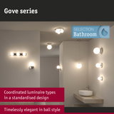 Gove series bathroom lights with matte white globes and chrome fixtures in coordinated design