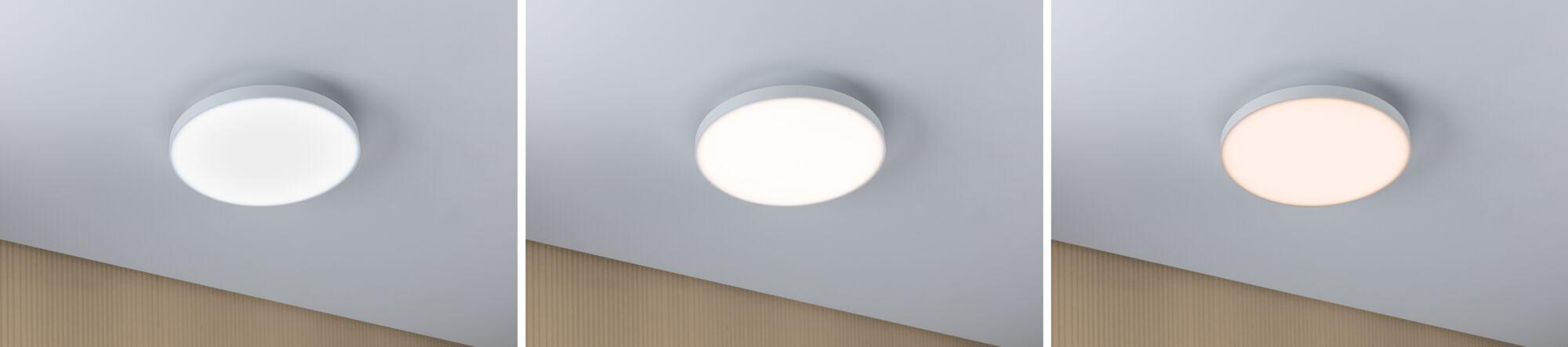 Drei runde weiße LED-Deckenleuchten mit verschiedenen Lichtfarben an grauer Decke.
