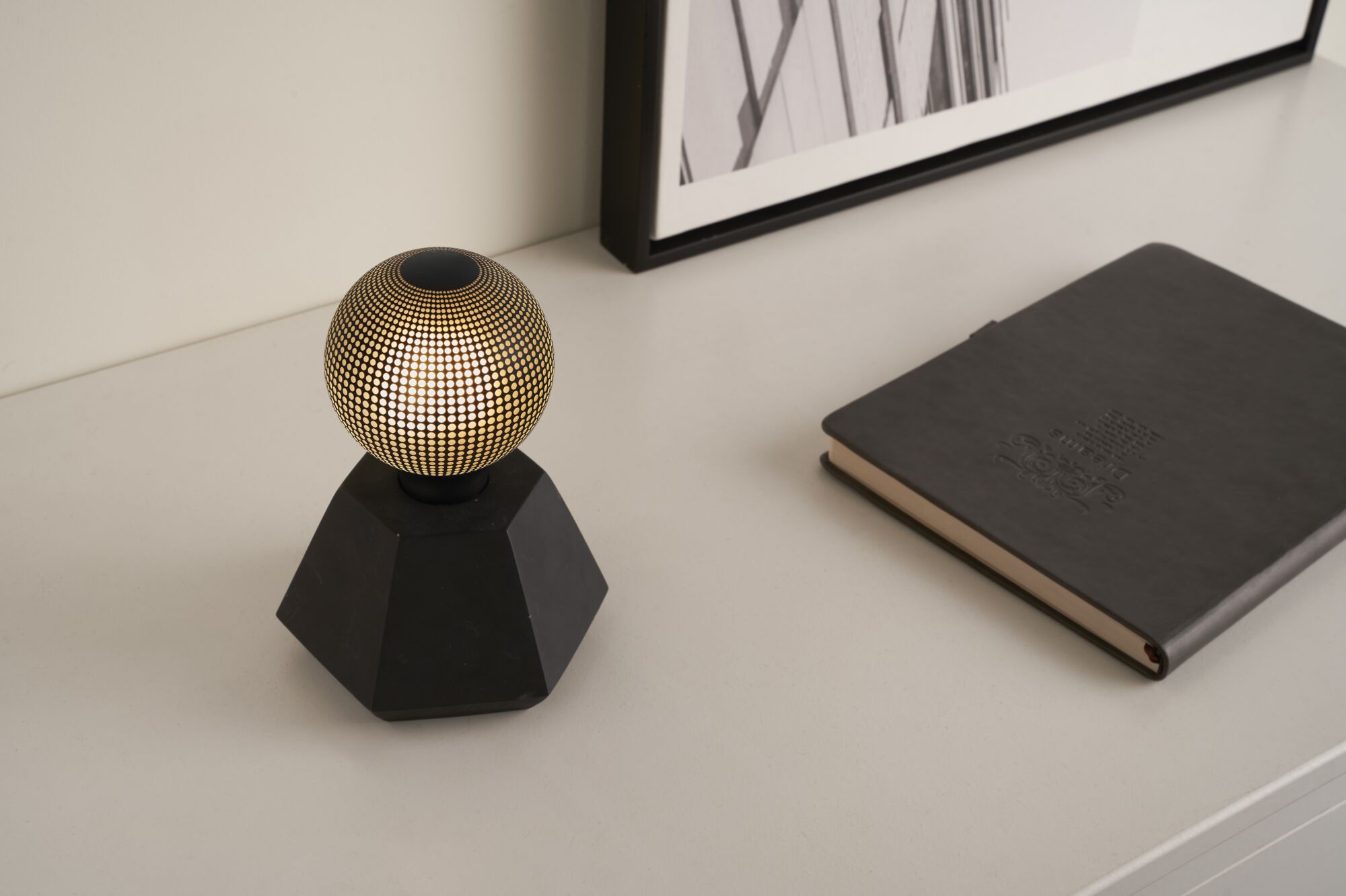 Modern table lamp with black base and gold dot pattern, decorative LED lighting for interiors
