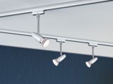 Three white metal LED spotlights on a ceiling track for adjustable room lighting