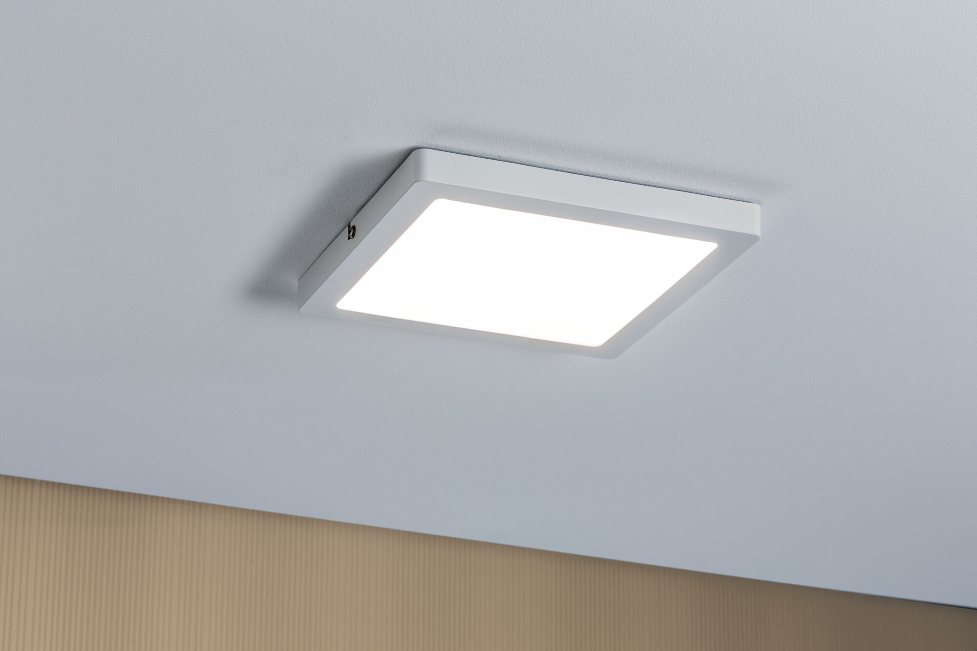 Square white LED ceiling light with modern design for energy-efficient room lighting.