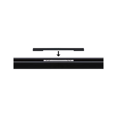 Black aluminum connector for LED track lighting with installation guide arrow.