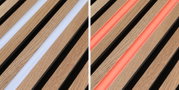 Nahaufnahme von Holzlamellen mit integriertem LED-Lichtstreifen in Weiß und Rot für moderne Beleuchtung