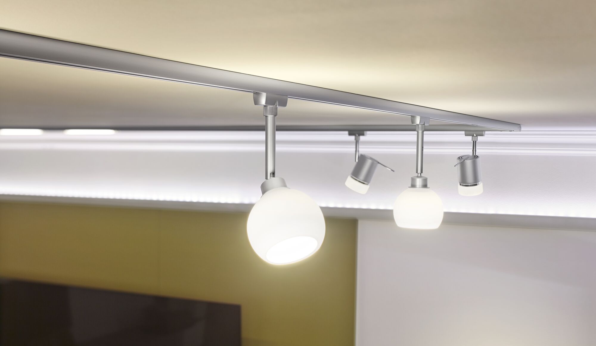 Modern ceiling light with white glass lamps and silver metal frame for living room lighting.