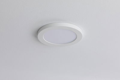 Round white LED ceiling light made of plastic for energy-efficient room lighting