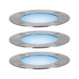 Tre runde LED-indbygningsgulvslamper i børstet rustfrit stål med blåt lys til udendørs brug