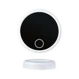 Round black LED touch switch with white plastic frame and separate mount for lighting control