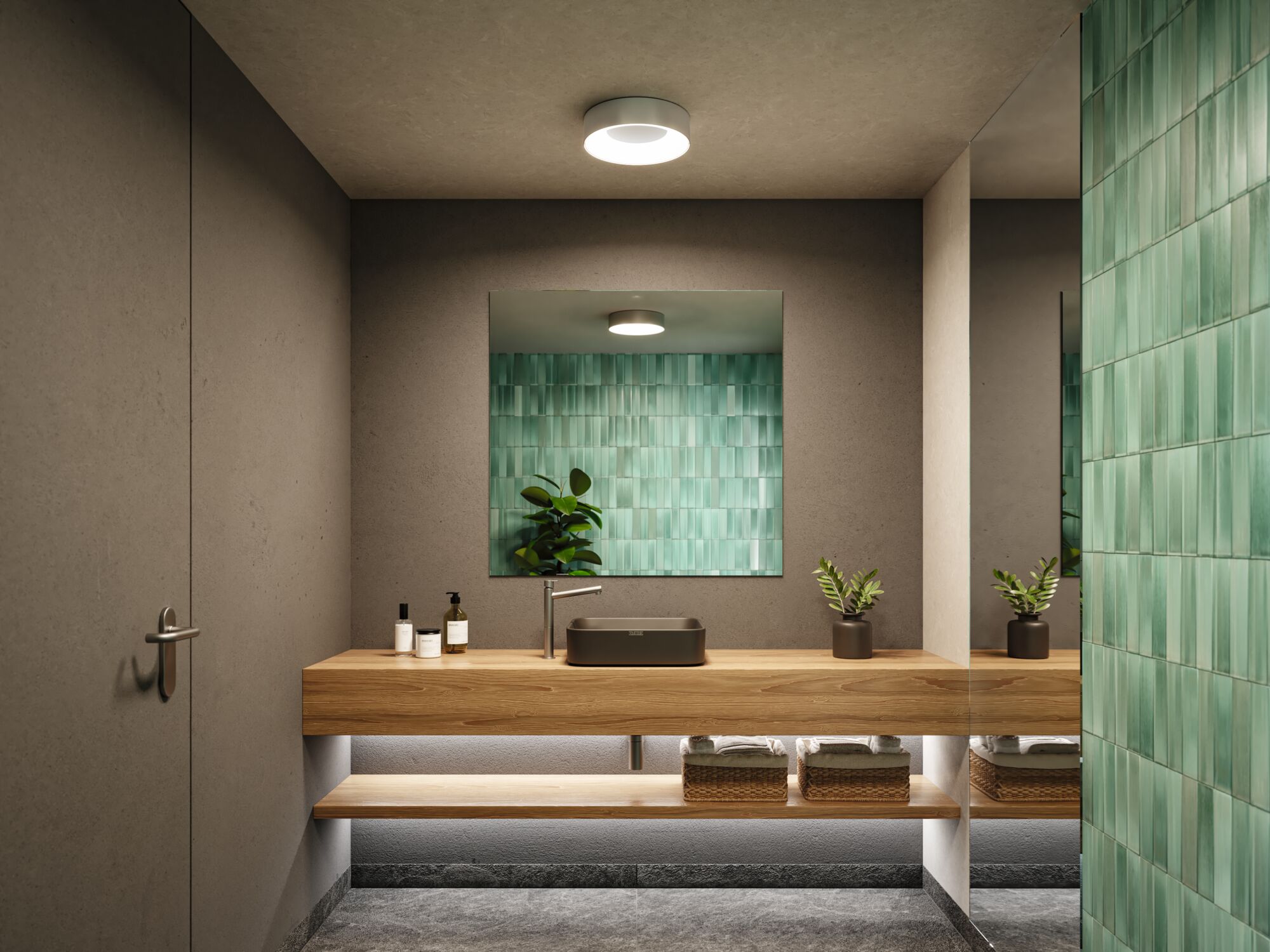 Modern bathroom with wooden vanity, black sink, green wall tiles, and LED ceiling light fixture