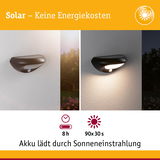 Schwarze Solar-Wandleuchte mit Bewegungsmelder, tagsüber aus, nachts mit warmweißem Licht, energiesparend