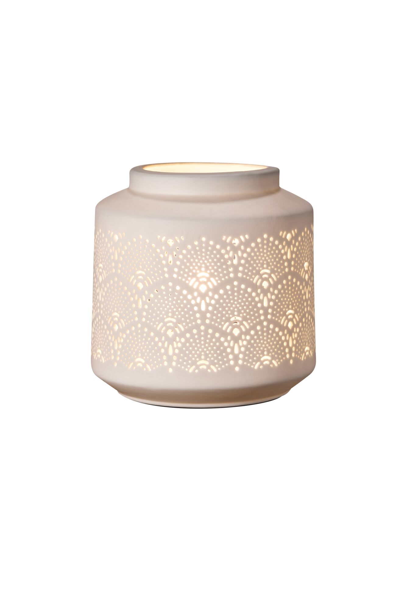 White ceramic table lamp with delicate perforated patterns and warm light for cozy ambient lighting