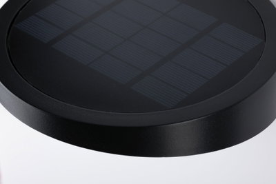 Round black solar panel with textured surface made of durable material for sustainable energy use.
