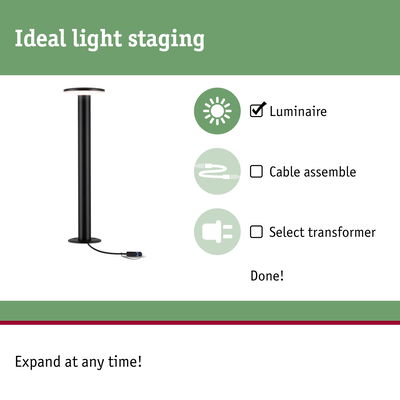 Black LED floor lamp with round light head and cable connection for indoor lighting