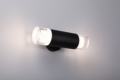 Modern black metal wall light with clear glass and warm white LED light for indoor lighting