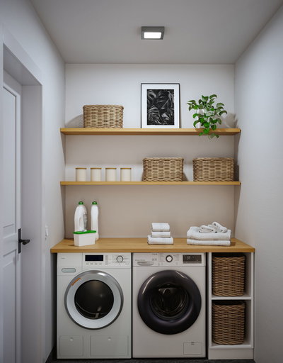 Moderne weiße Waschmaschine und Trockner mit Holzarbeitsplatte und geflochtenen Körben in heller Waschküche