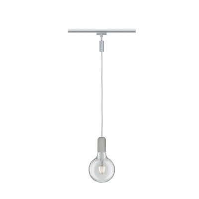 Pendant light with clear glass bulb and grey concrete socket on silver track lighting