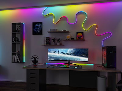 Modernes Gaming-Setup mit ultrabreitem Monitor und bunten LED-Lichtleisten aus flexiblen RGB-Streifen.