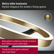 Melira table luminaire in brushed gold and matt black with warm white LED light for stylish modern spaces