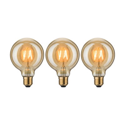 Three round LED bulbs with warm white light and amber glass for decorative lighting solutions.
