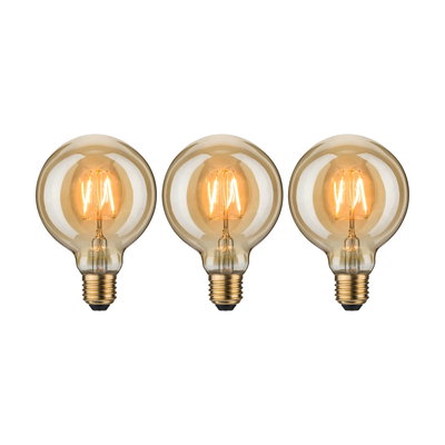 Drei runde LED-Glühbirnen mit warmweißem Licht und bernsteinfarbenem Glas für dekorative Beleuchtung.