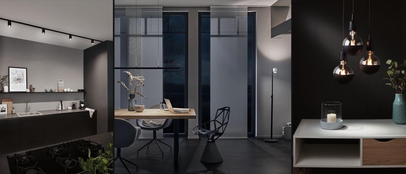 Modernes Interieur mit schwarzen LED-Deckenstrahlern, Stehlampe und hängenden Glaskugelleuchten für Wohnraumbeleuchtung