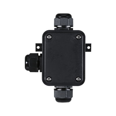 Black plastic junction box with cable glands for electrical wiring and connections