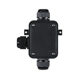 Black plastic junction box with cable glands for electrical wiring and connections