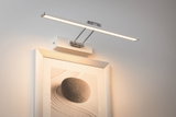 Moderne LED-Bilderleuchte in Weiß mit Aluminiumarm zur Wandmontage für stimmungsvolle Beleuchtung.