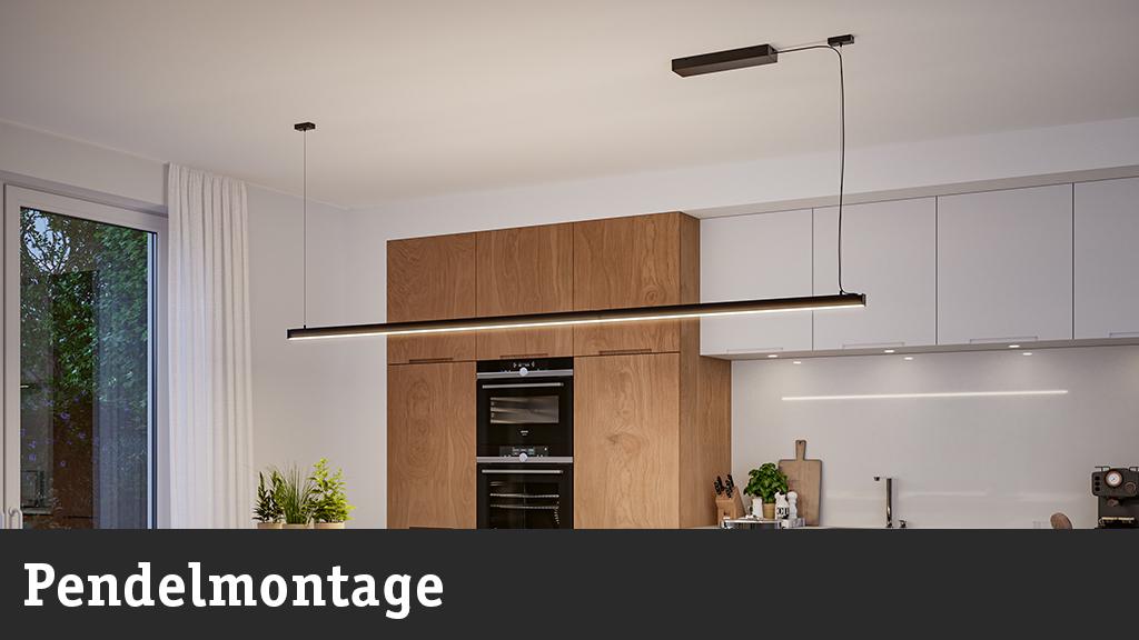 Schwarze LED-Pendelleuchte in moderner Küche mit Holzschränken und weißen Fronten, energiesparende Beleuchtung.