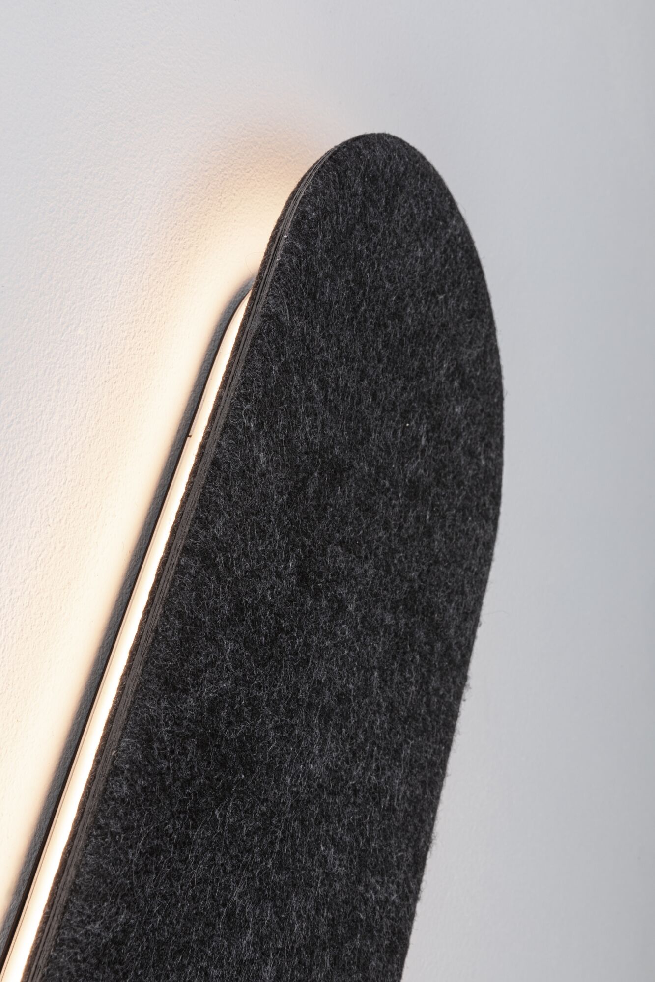 Black felt wall lamp with warm white LED light for modern home lighting design